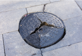 Damaged manhole cover / drain
