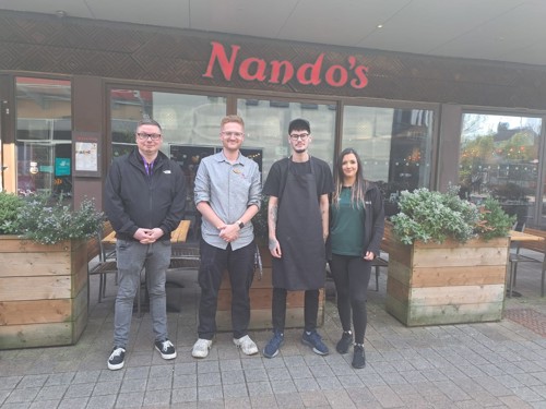 Milan standing outside Nando's restaurant in Llanelli