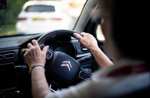 Volunteer behind the wheel of the car