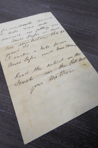 Aged paper with cursive writing in black ink.