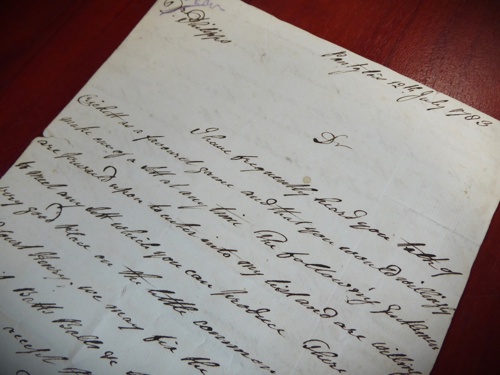 Image of an aged piece of paper with cursive handwriting.